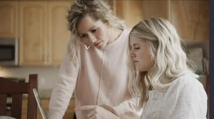 Female student and leaning coach reviewing an assignment togetther on a computer